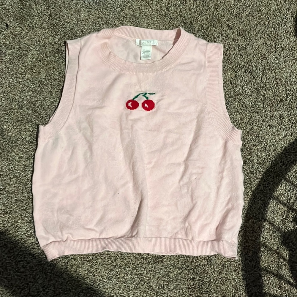 Never worn vest. Color pink with cherrys on the front.